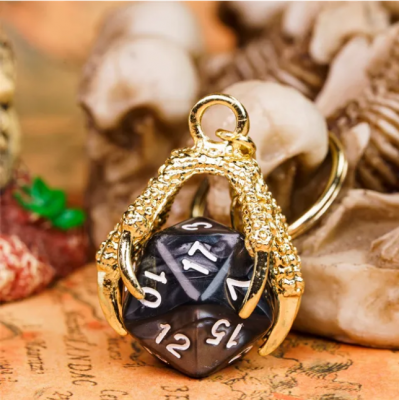 Porte clef dragon avec D20 noir